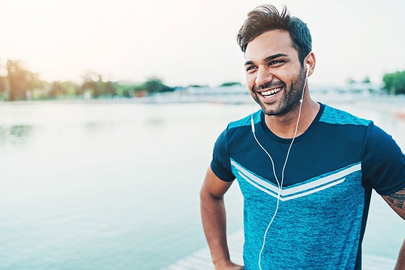 man listening to music on headphones